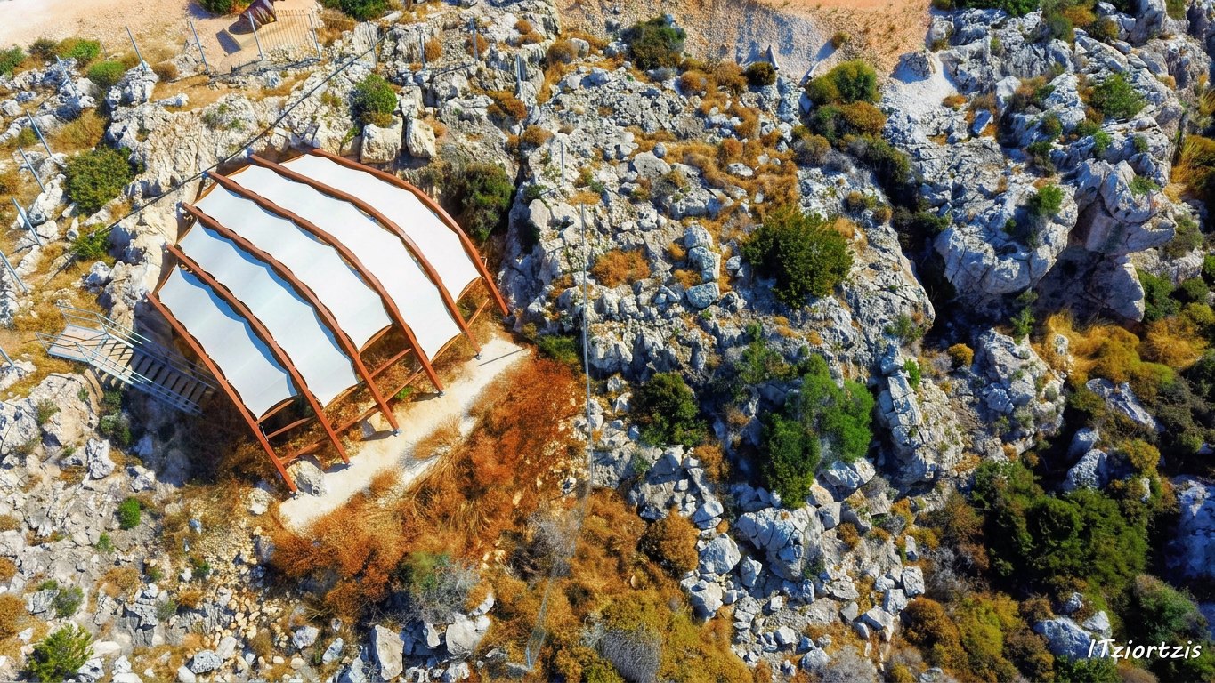 Aerial view of the protective canopy sheltering the palaeontological cave in the rocky Cavo Greco landscape — Ayia Napa Parks (Plate I)